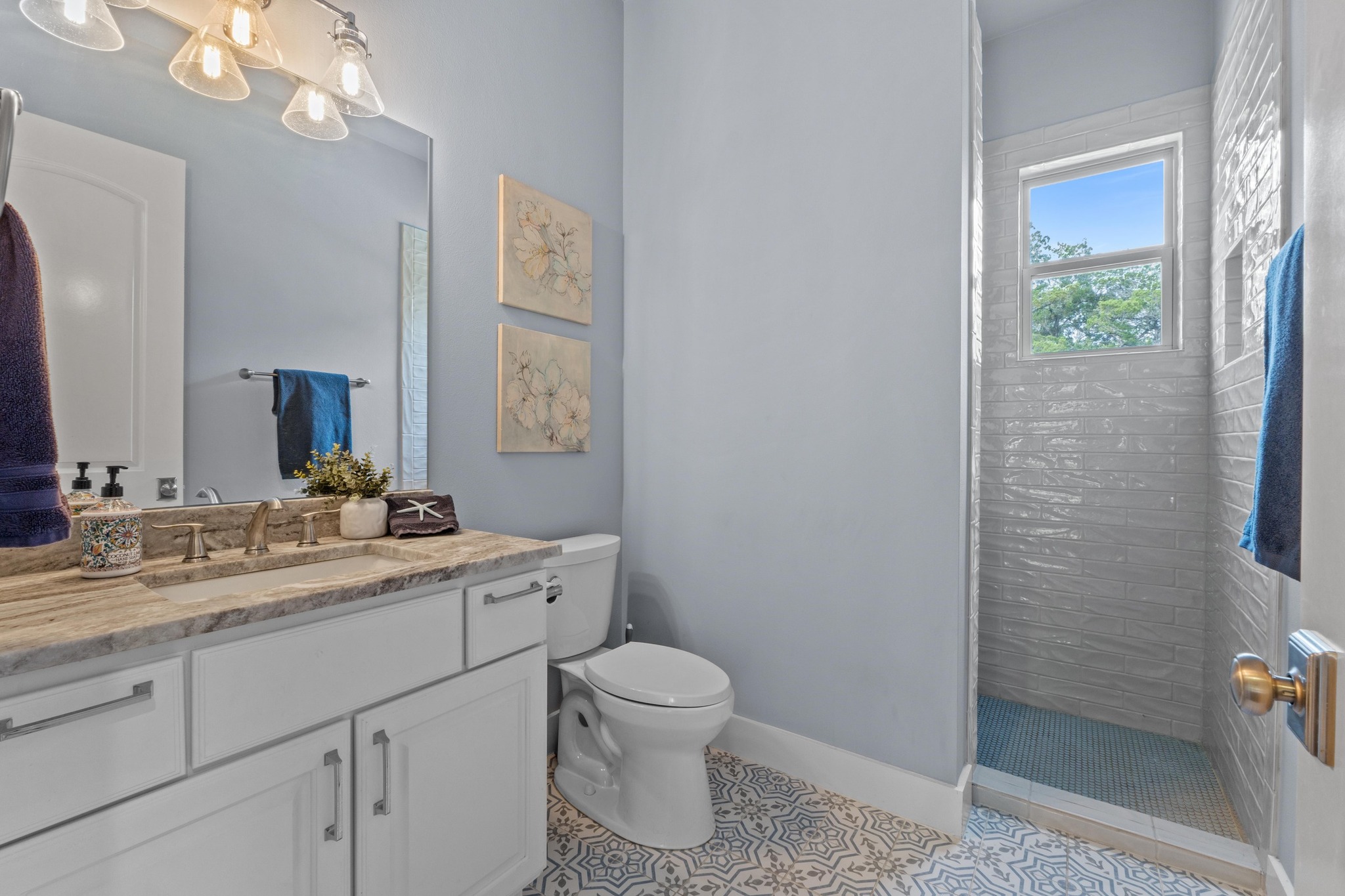 18817 Hidden Ridge Place Jonestown, TX 78645 - Photo 27 of 40 Bathroom with tile patterned floors, toilet, baseboards, vanity, and a walk in shower