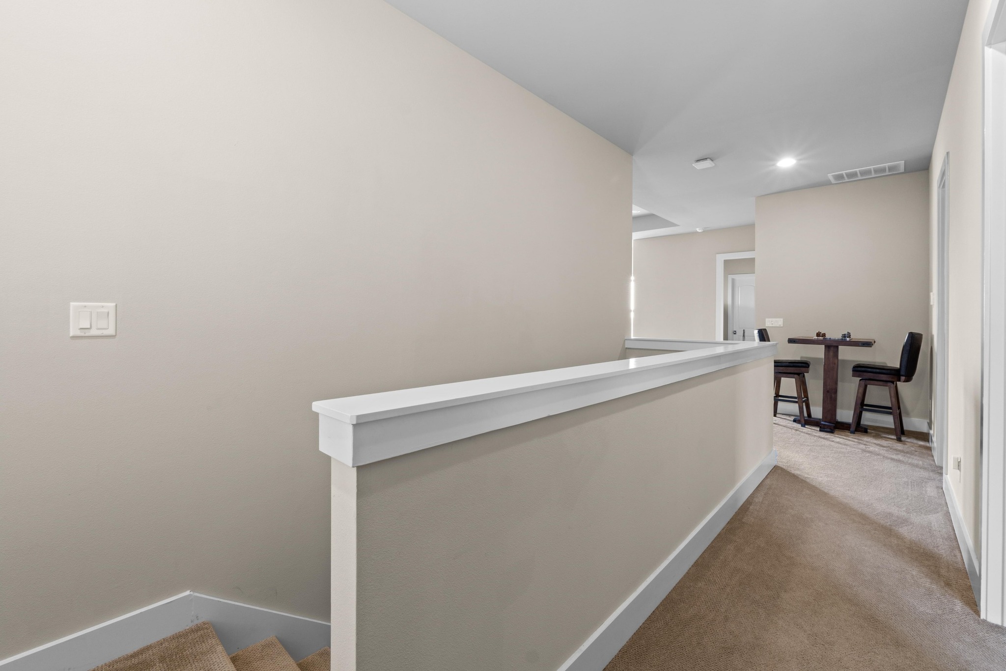 18817 Hidden Ridge Place Jonestown, TX 78645 - Photo 28 of 40 Hall featuring carpet flooring, baseboards, visible vents, recessed lighting, and an upstairs landing