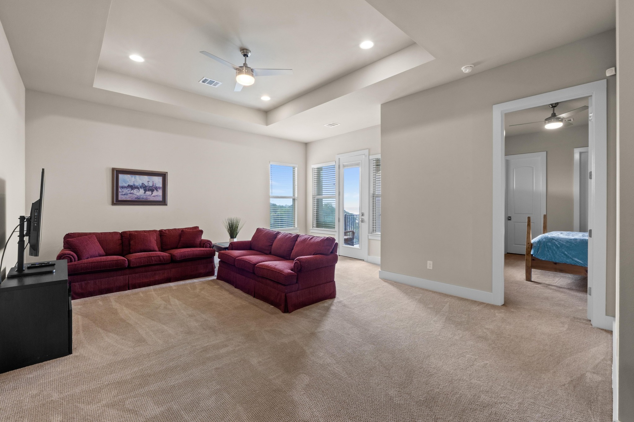 18817 Hidden Ridge Place Jonestown, TX 78645 - Photo 29 of 40 Living room featuring recessed lighting, a raised ceiling, visible vents, light carpet, and ceiling fan