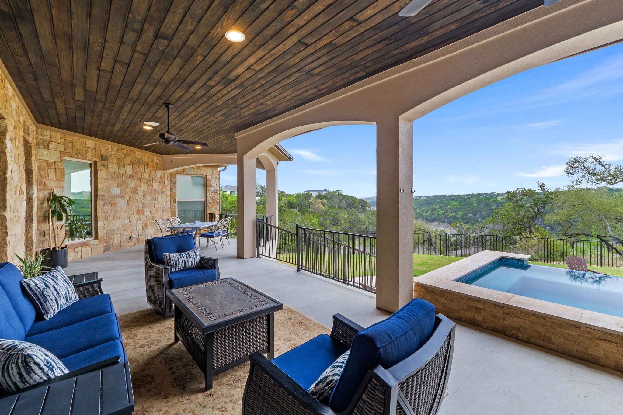 18817 Hidden Ridge Place Jonestown, TX 78645 - Photo 38 of 40 a living room with furniture and a floor to ceiling window