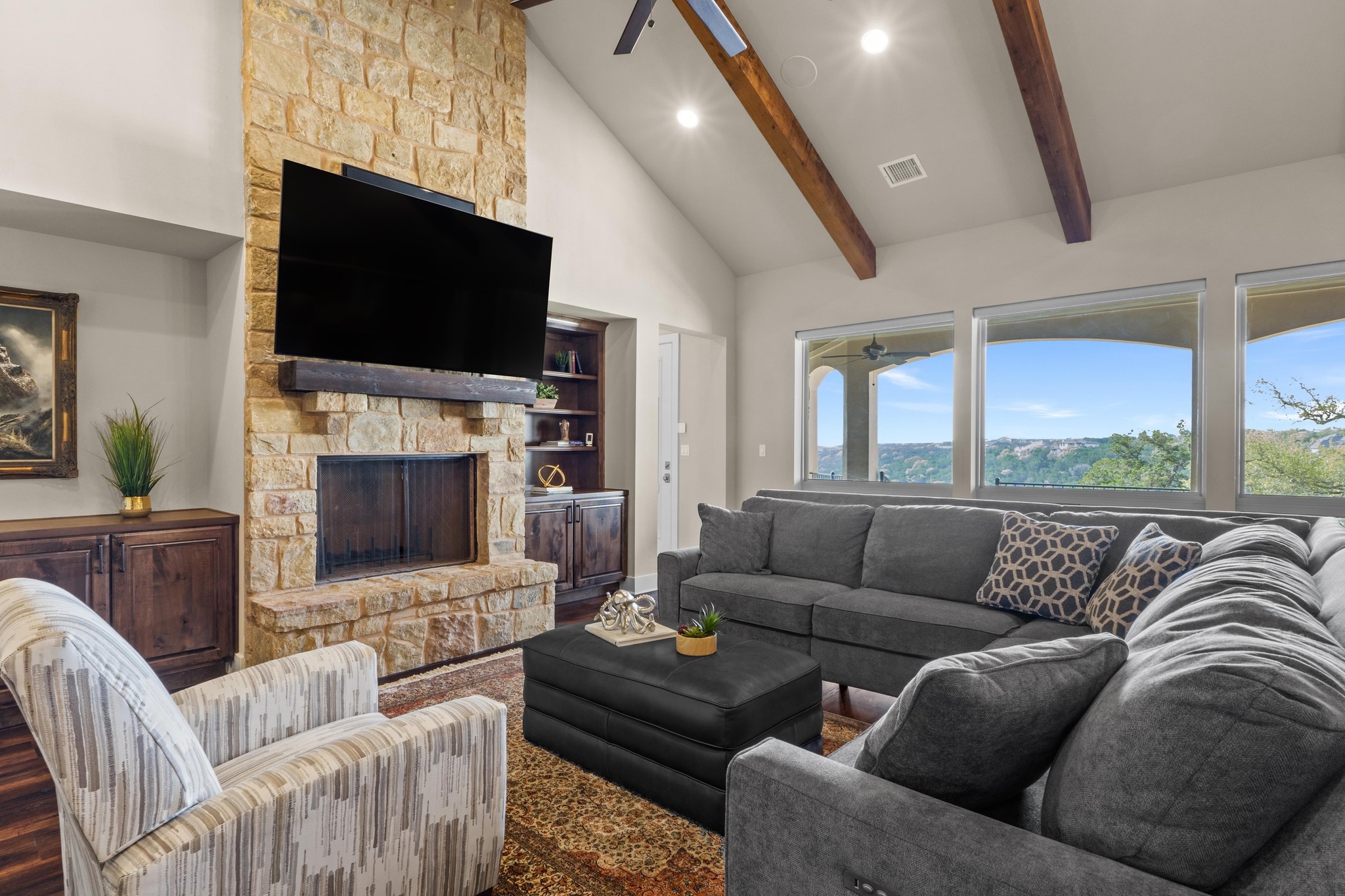 18817 Hidden Ridge Place Jonestown, TX 78645 - Photo 6 of 40 a living room with furniture fireplace and flat screen tv