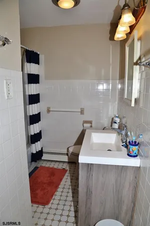 a bathroom with a bathtub and a sink