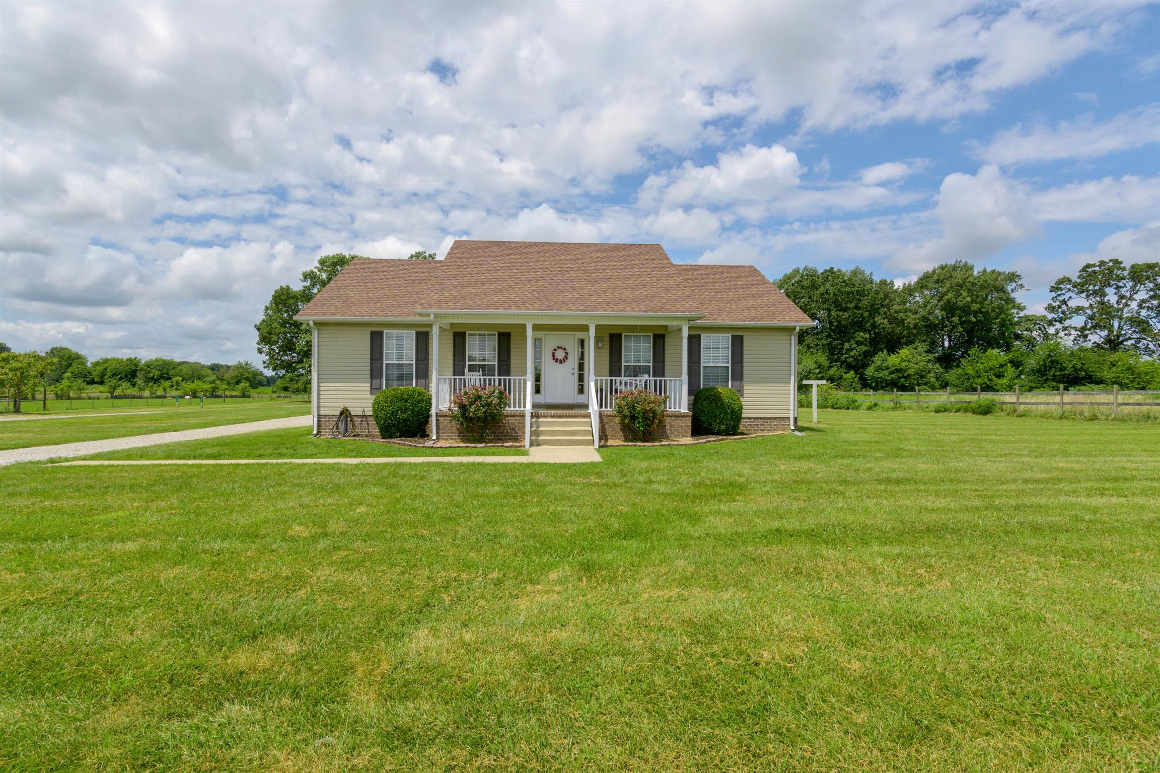 5184 Youngville Road Springfield, TN 37172 - Photo 1 of 29 a front view of a house with a garden