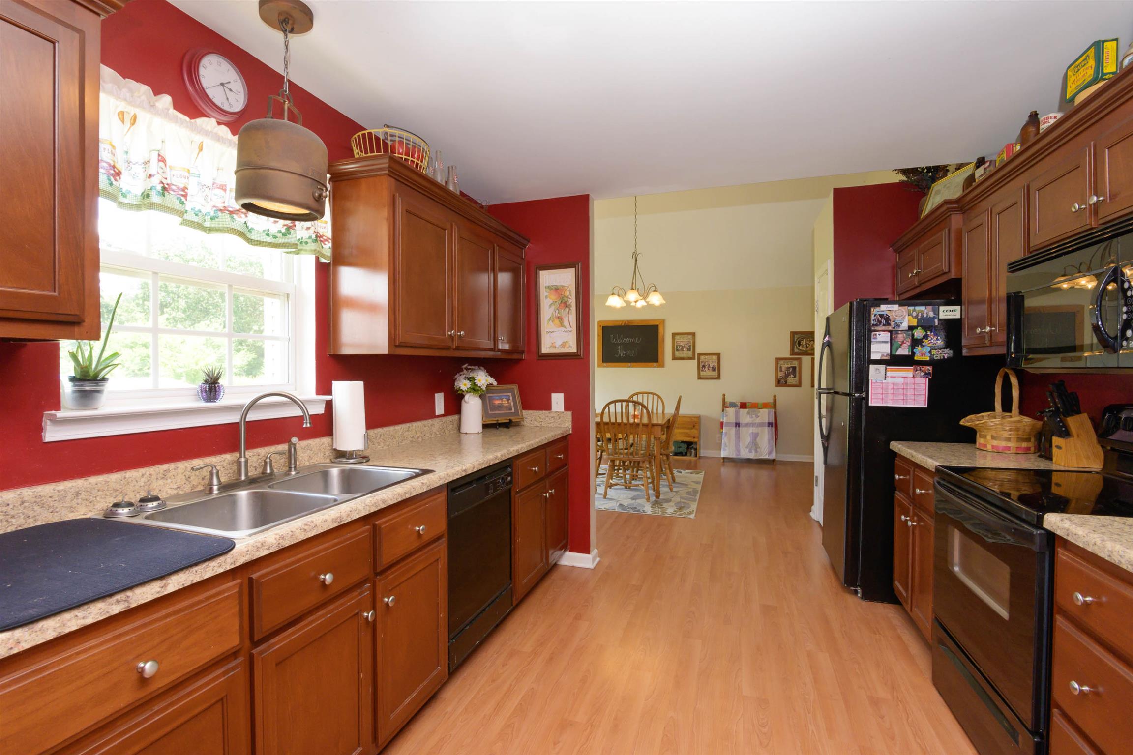 5184 Youngville Road Springfield, TN 37172 - Photo 11 of 29 a kitchen with lots of counter top space and wooden floor
