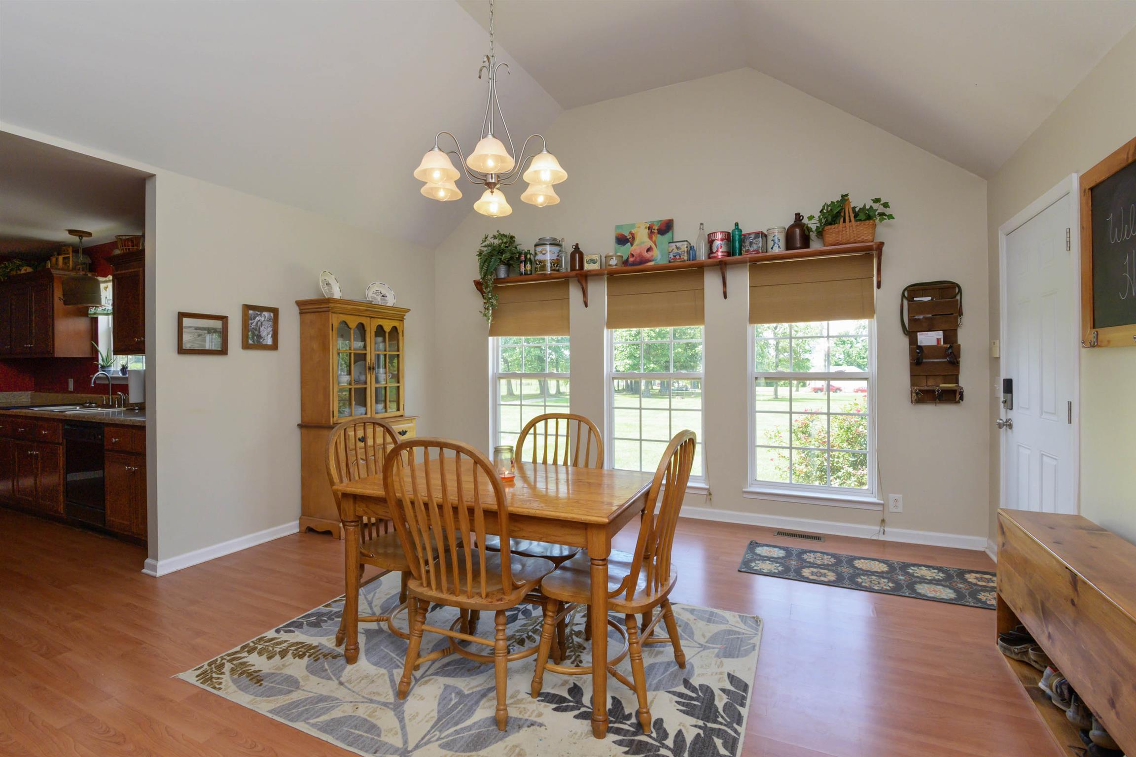 5184 Youngville Road Springfield, TN 37172 - Photo 12 of 29 a view of a dining room with furniture window and wooden floor