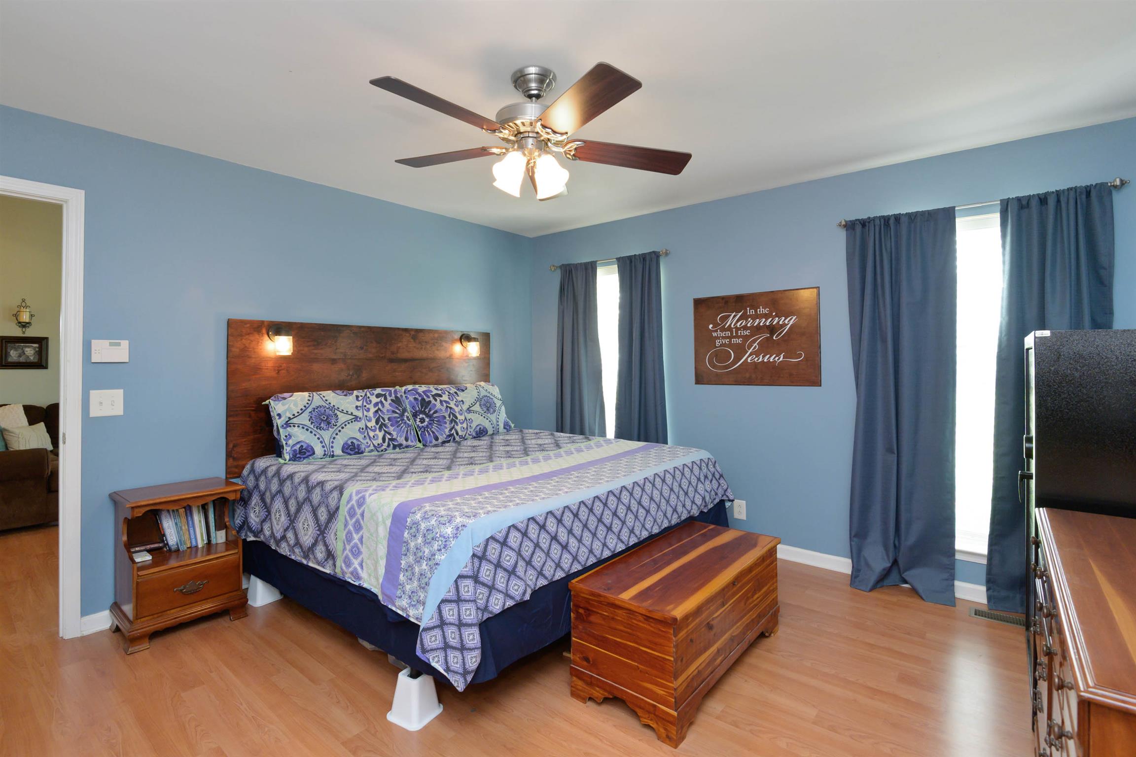 5184 Youngville Road Springfield, TN 37172 - Photo 17 of 29 a bedroom with a bed and a flat screen tv
