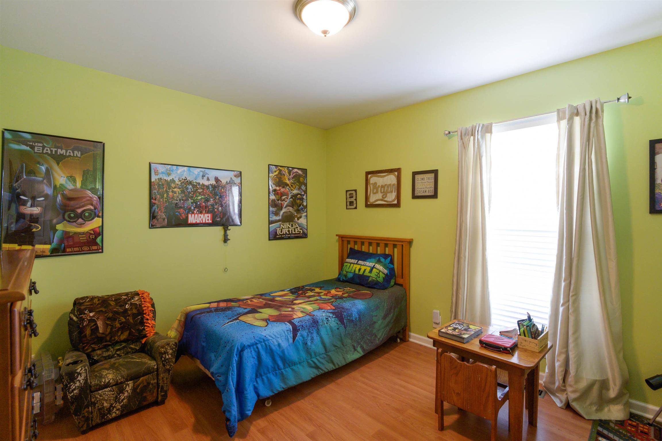 5184 Youngville Road Springfield, TN 37172 - Photo 29 of 29 a bedroom with a bed and wooden floor