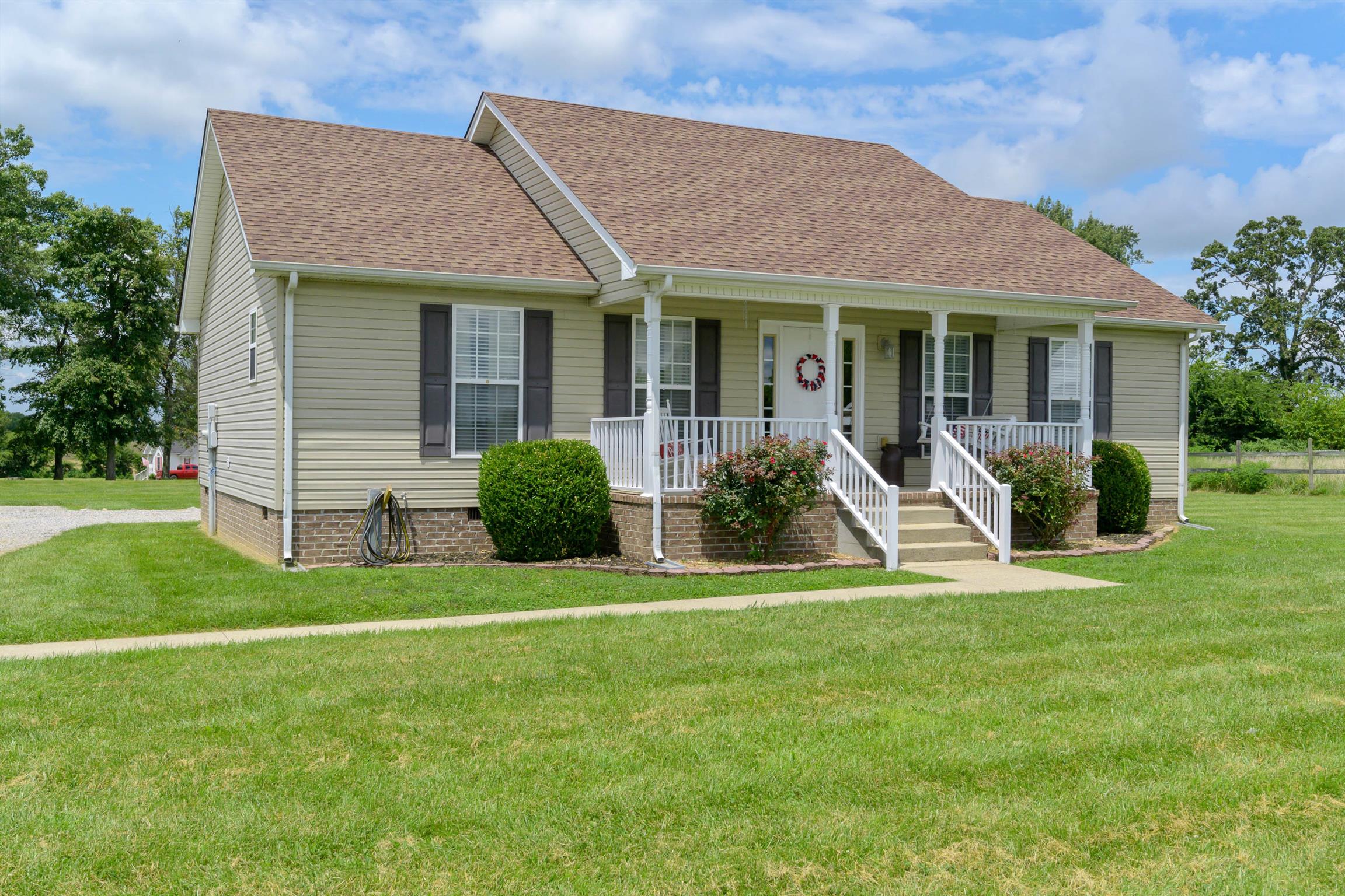 5184 Youngville Road Springfield, TN 37172 - Photo 2 of 29 a front view of a house with a yard and porch
