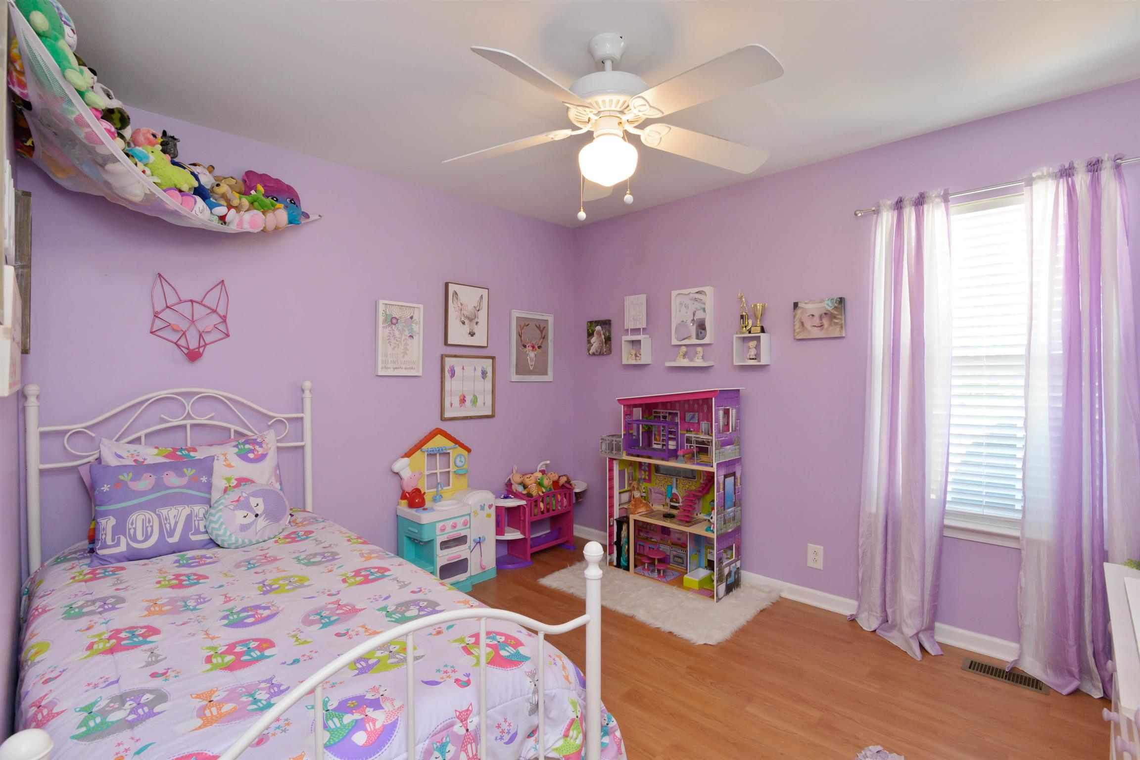 5184 Youngville Road Springfield, TN 37172 - Photo 23 of 29 a bedroom with a bed and wooden floor