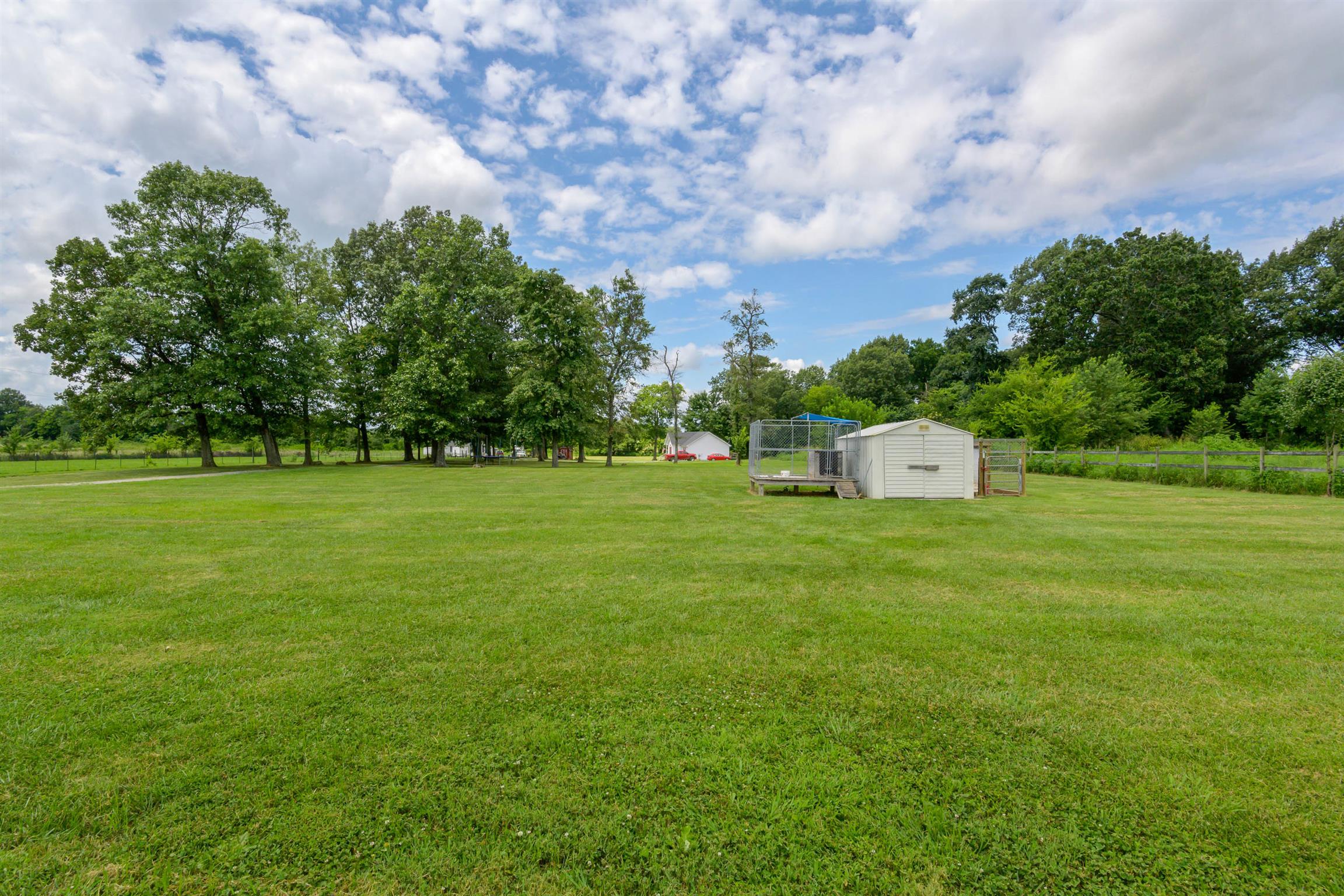5184 Youngville Road Springfield, TN 37172 - Photo 25 of 29 a picture of a field with plants and trees in the background