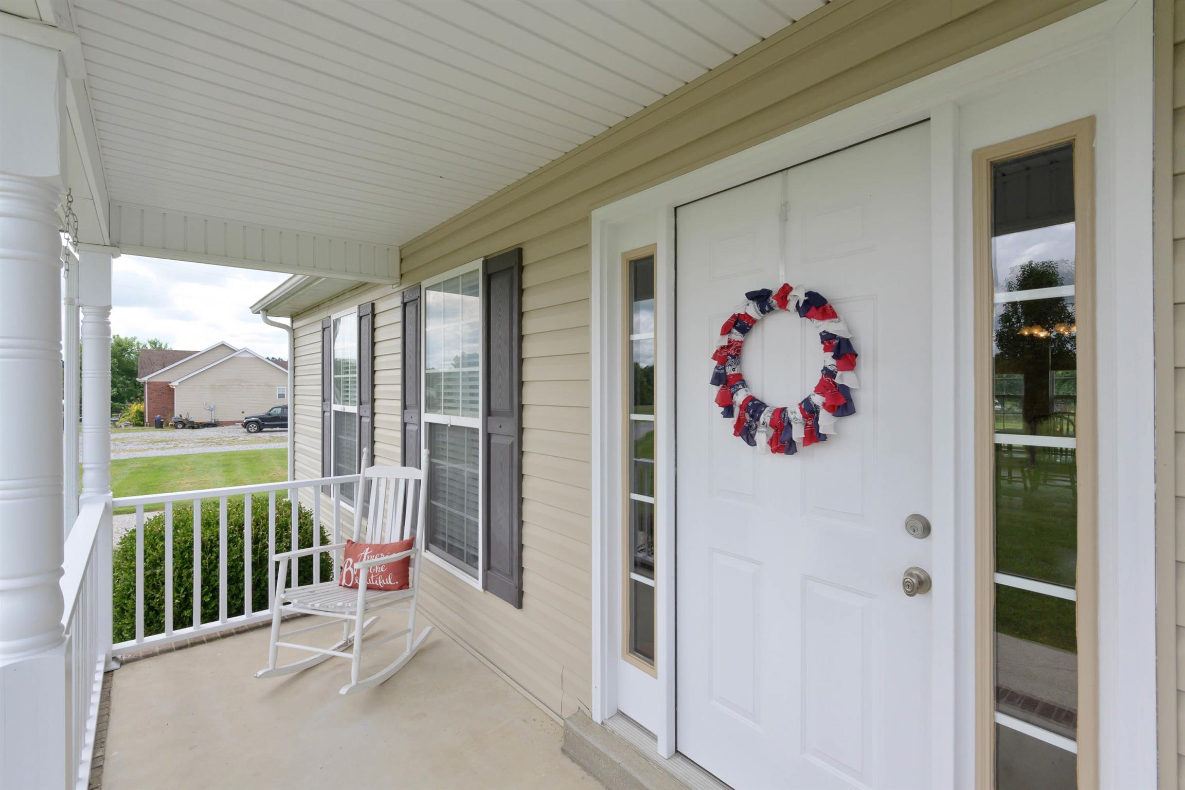 5184 Youngville Road Springfield, TN 37172 - Photo 4 of 29 a view of a balcony with refrigerator and book shelf