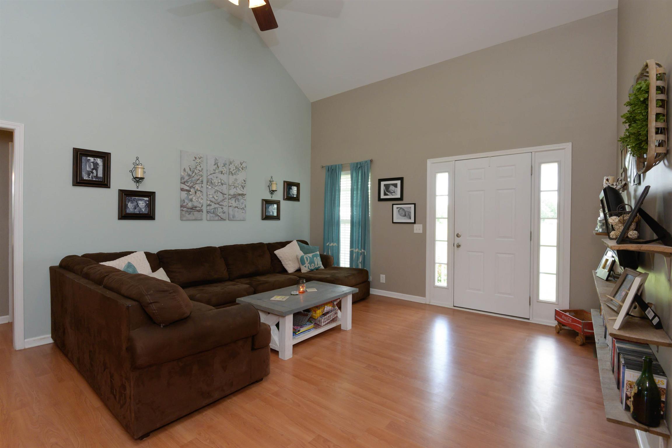 5184 Youngville Road Springfield, TN 37172 - Photo 5 of 29 a living room with furniture and a flat screen tv