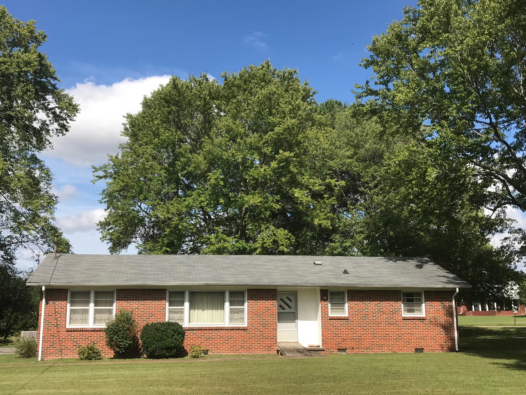 413 Shelton Road Manchester, TN 37355 - Photo 1 of 18 a front view of a house with yard