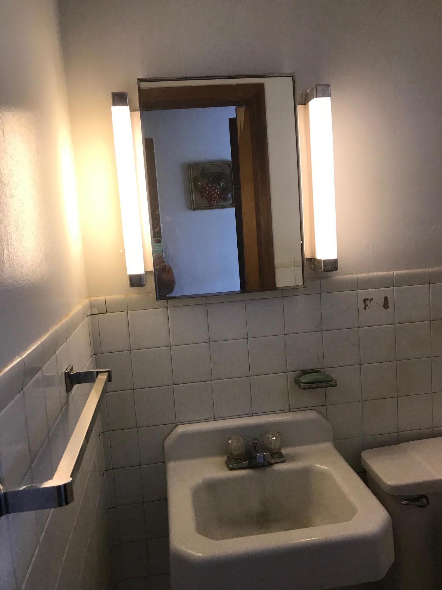 413 Shelton Road Manchester, TN 37355 - Photo 12 of 18 a bathroom with a sink and a mirror