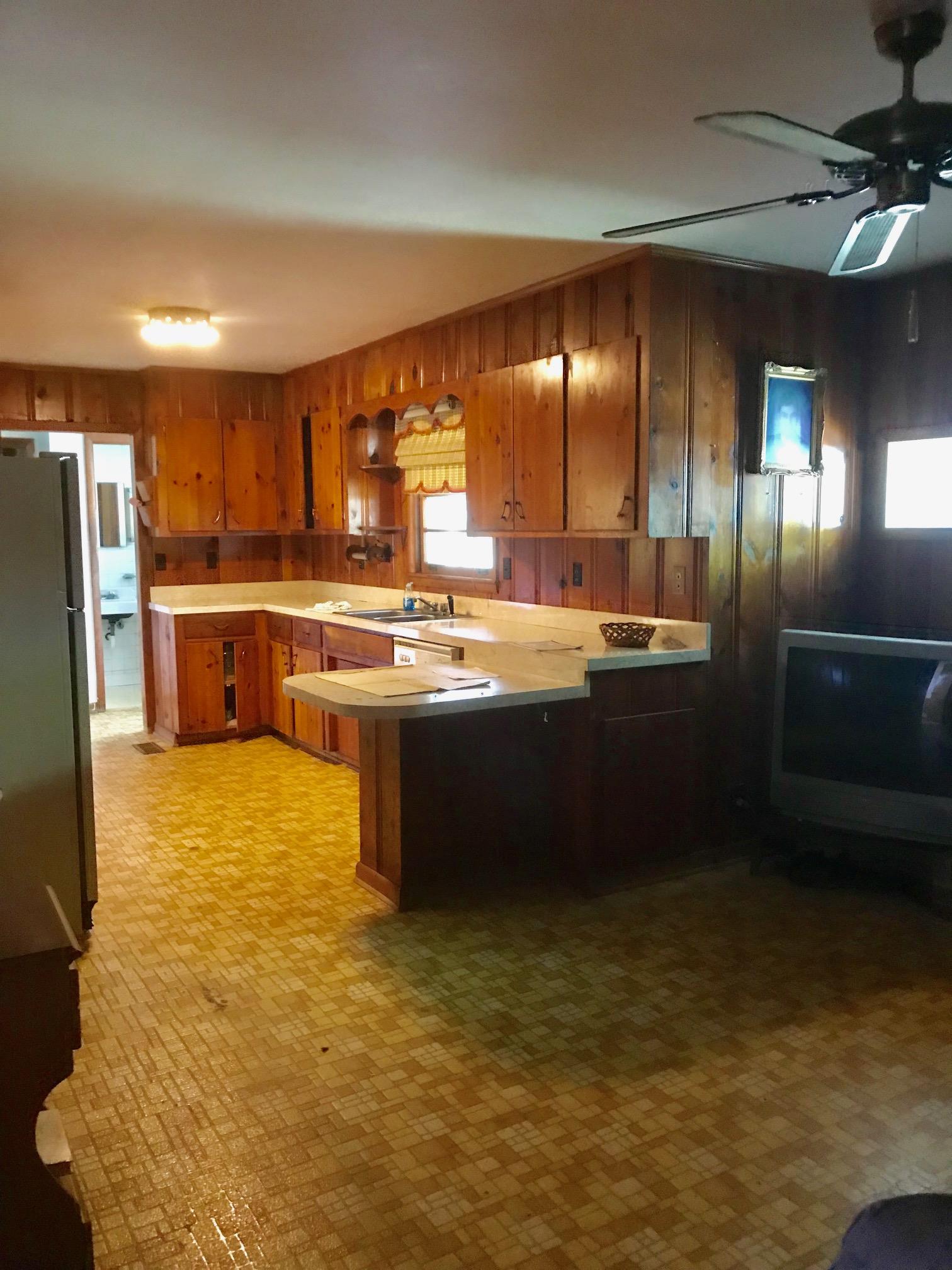 413 Shelton Road Manchester, TN 37355 - Photo 5 of 18 a kitchen with stainless steel appliances granite countertop a sink a stove and a refrigerator