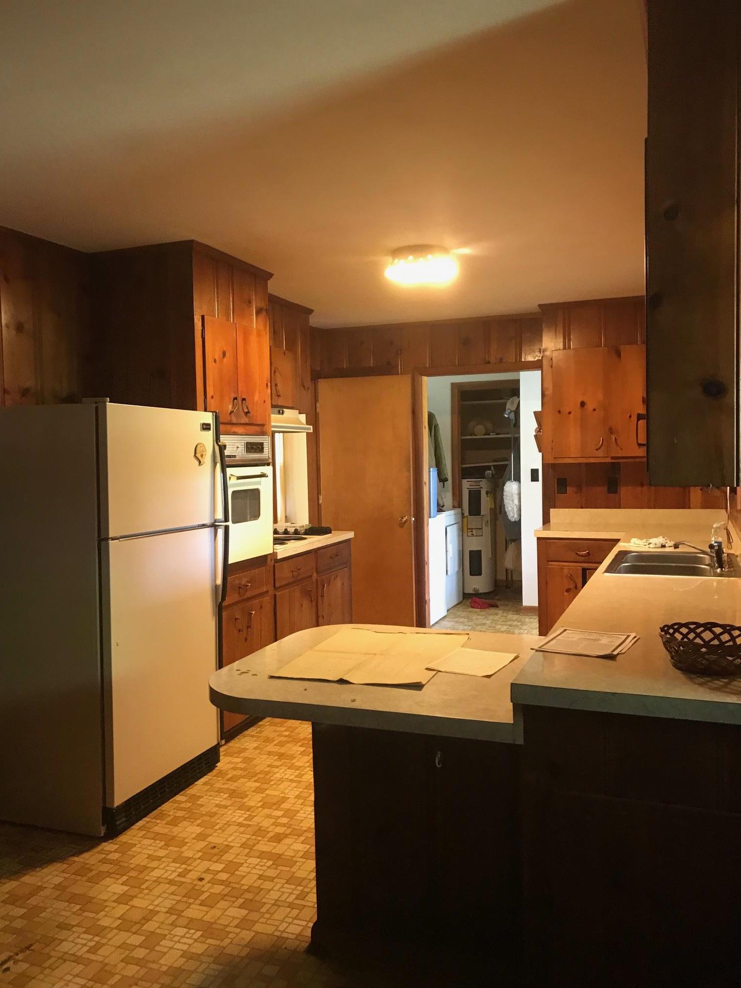 413 Shelton Road Manchester, TN 37355 - Photo 6 of 18 a kitchen with refrigerator and stove