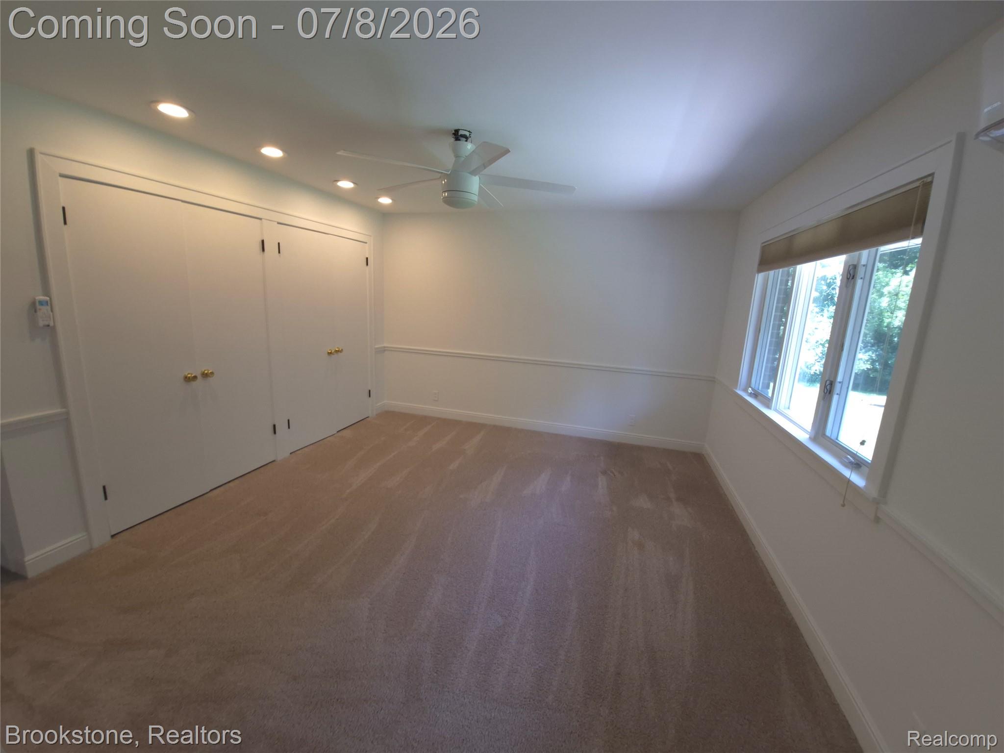 4140 South Henderson Road Davison, MI 48423 - Photo 61 of 98 Neutral-toned carpeting complements the white walls and trim