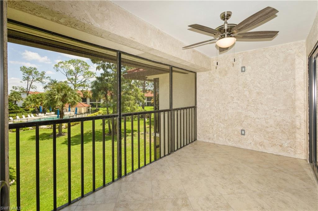 4963 Pepper Circle, Unit D202 Naples, FL 34113 - Photo 15 of 17 a view of a porch with a floor to ceiling window