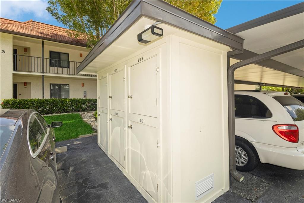 4963 Pepper Circle, Unit D202 Naples, FL 34113 - Photo 3 of 17 a view of outdoor space and yard