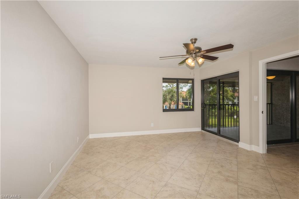 4963 Pepper Circle, Unit D202 Naples, FL 34113 - Photo 9 of 17 a view of an empty room with a window