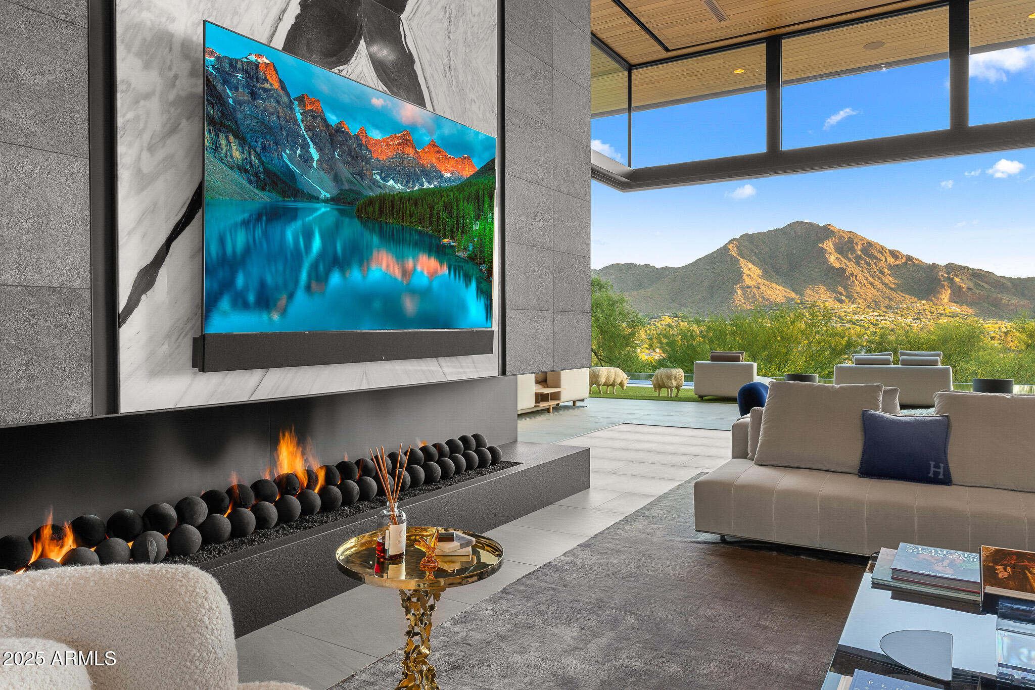 6149 East Indian Bend Road Paradise Valley, AZ 85253 - Photo 60 of 77 a living room with furniture and a fireplace