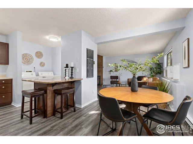 a kitchen with kitchen island a sink stainless steel appliances and refrigerator