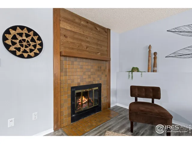 a bedroom with a bed and a large mirror