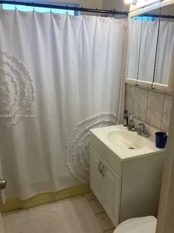 a bathroom with a sink and mirror