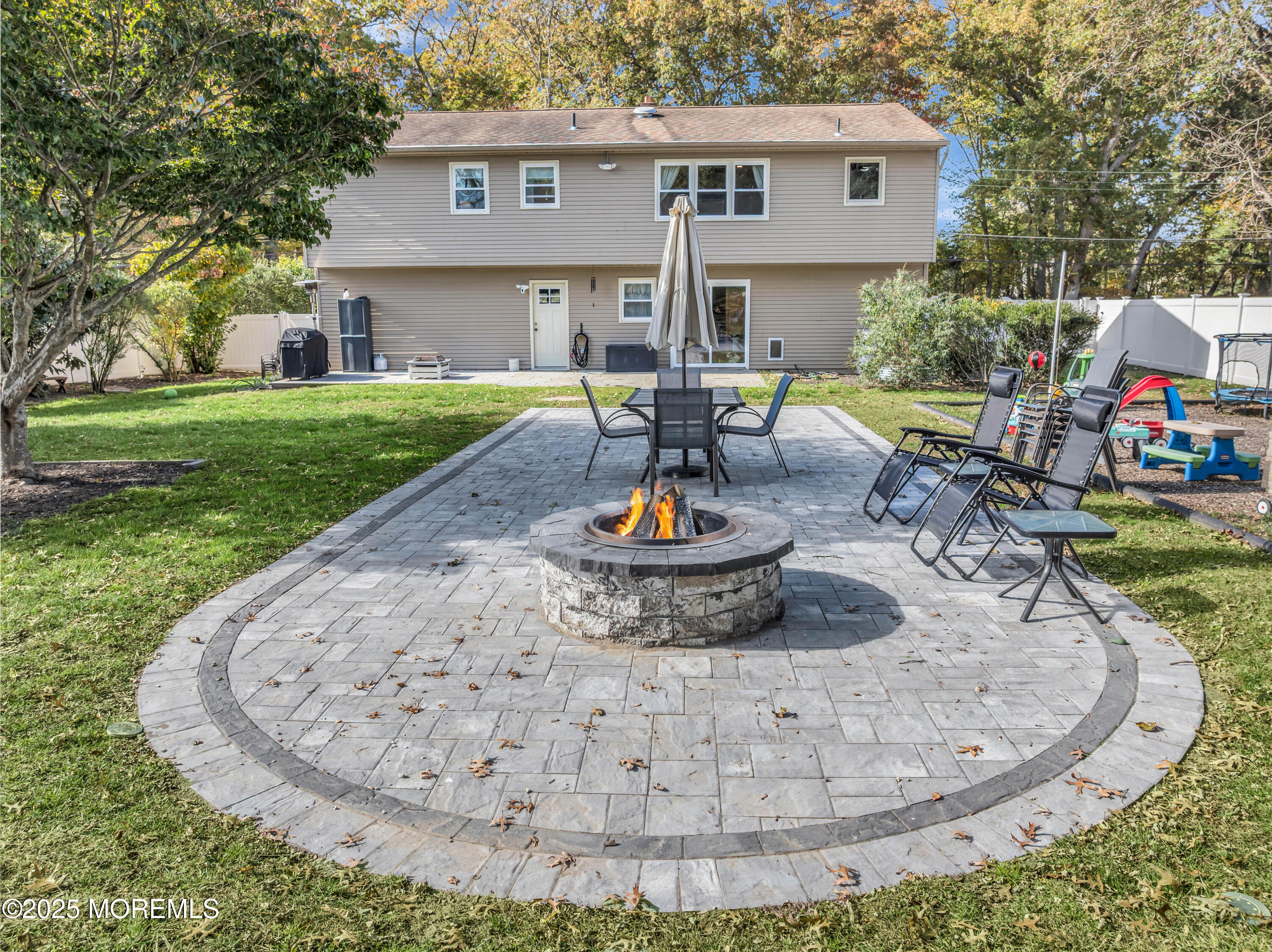 35 Merrick Road Farmingdale, NJ 07727 - Photo 31 of 47 a view of a house with backyard swimming pool and sitting area