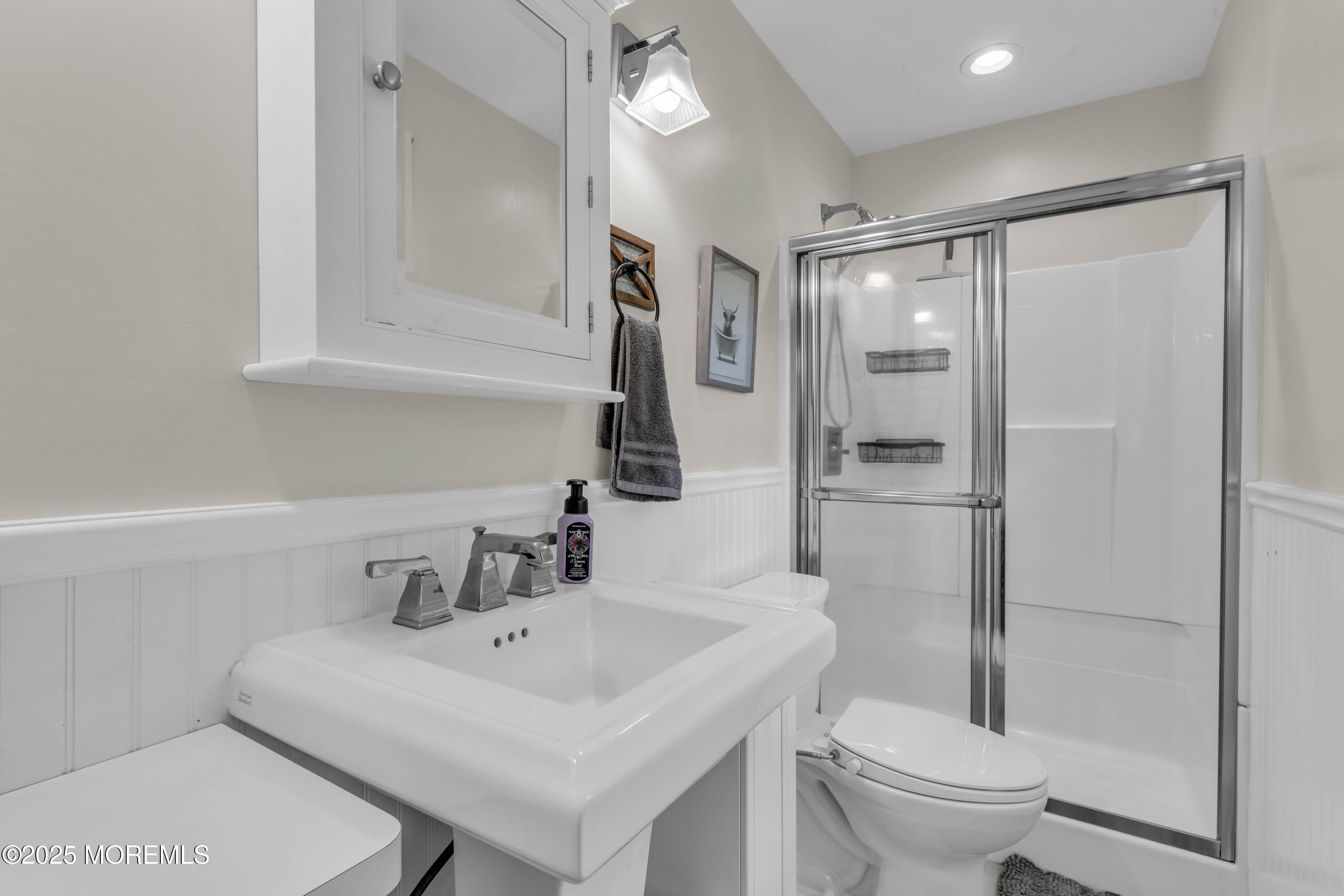 35 Merrick Road Farmingdale, NJ 07727 - Photo 8 of 47 a bathroom with a sink toilet and shower