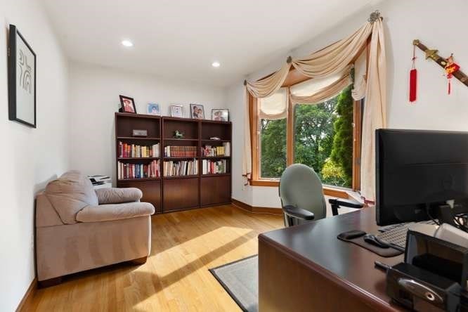55 Meriam Street Lexington, MA 02420 - Photo 18 of 37 a living room with furniture and a flat screen tv