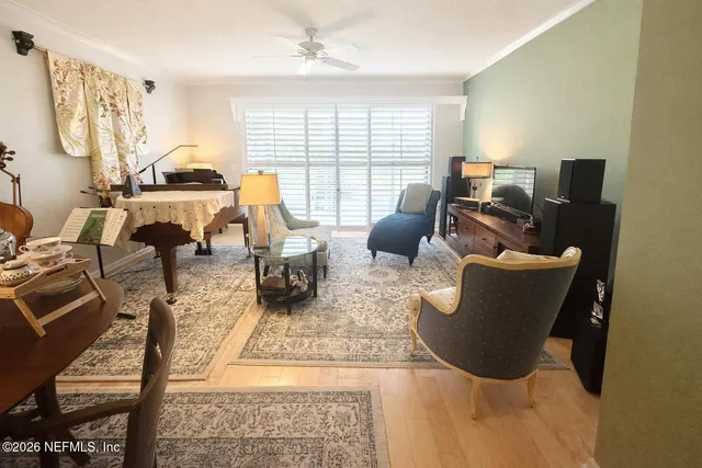 a living room with furniture rug and window
