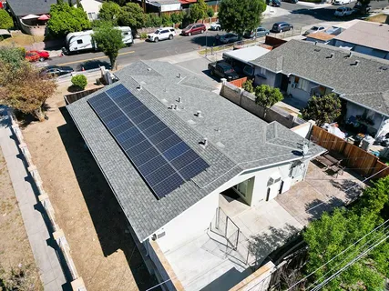 an aerial view of a house with a yard