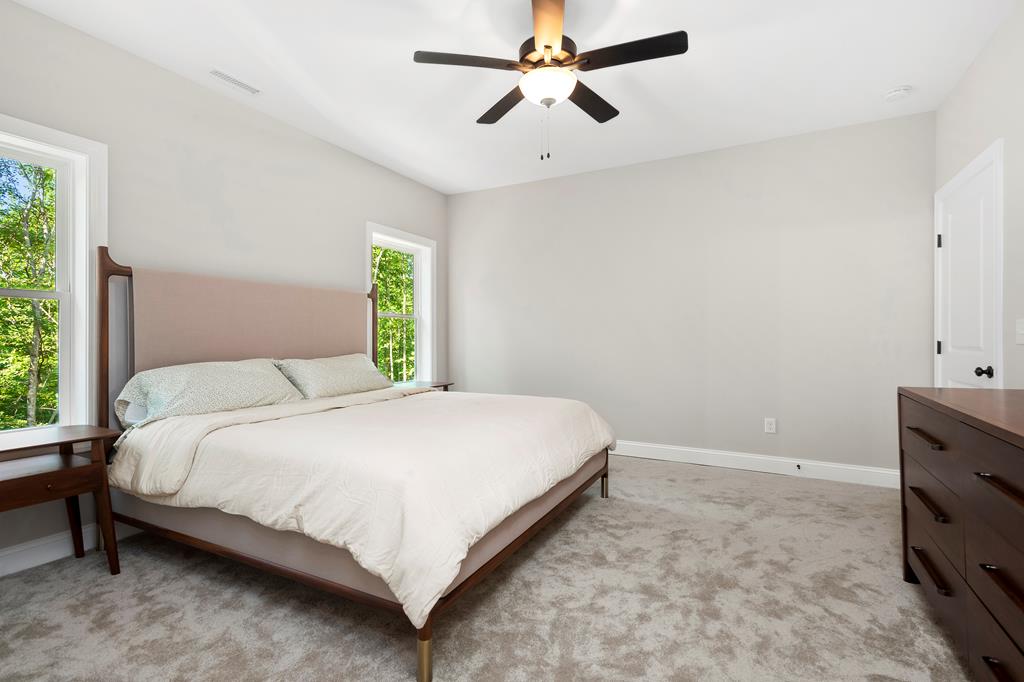 8 Hawks Nest Road Blairsville, GA 30512 - Photo 14 of 30 a bedroom with a bed and a window