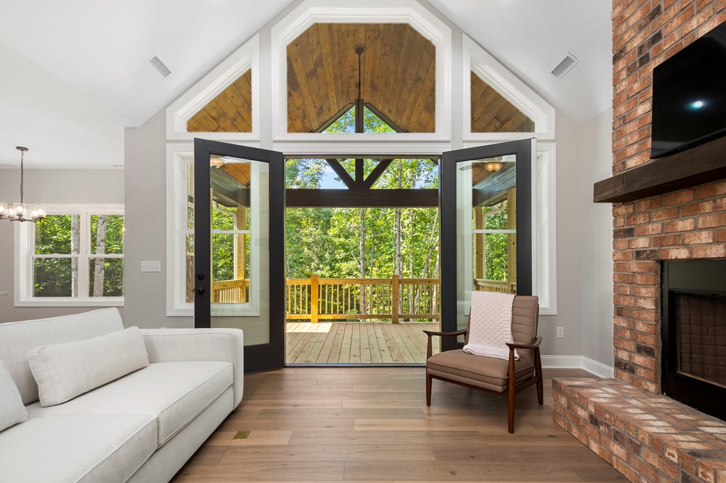 8 Hawks Nest Road Blairsville, GA 30512 - Photo 18 of 30 a living room with furniture and a fireplace