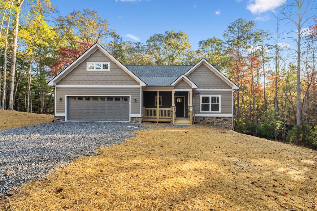 8 Hawks Nest Road Blairsville, GA 30512 - Photo 27 of 30 a front view of a house with a garden and porch