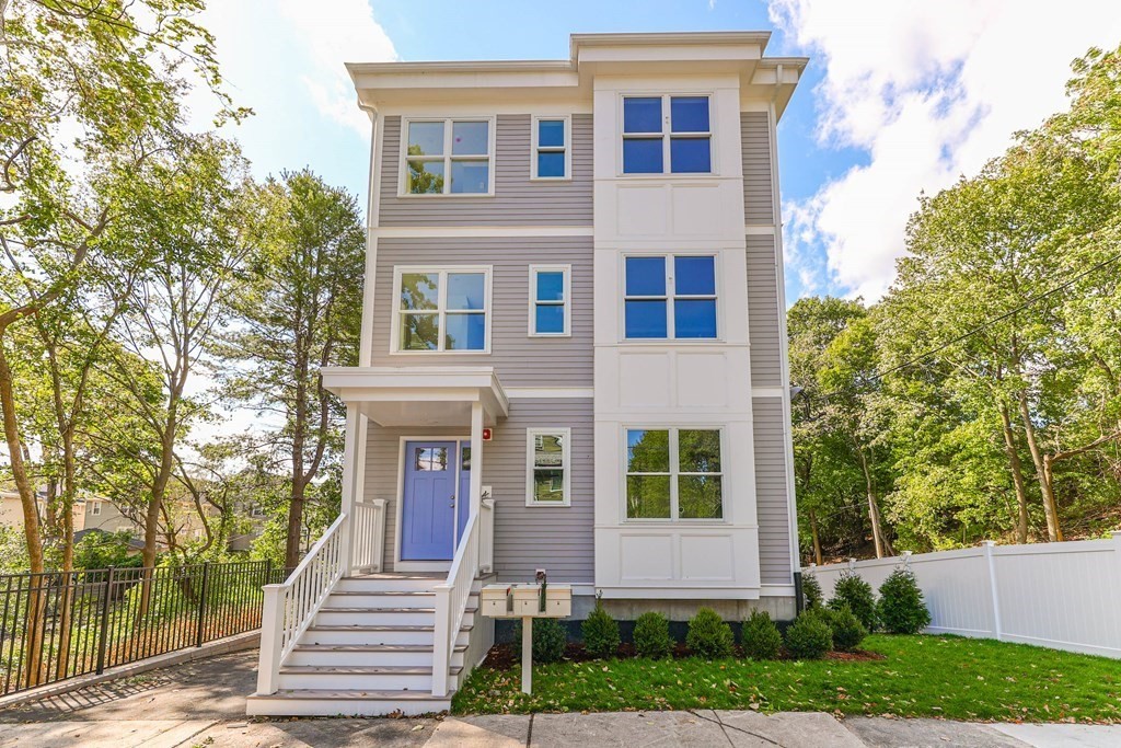 front view of a house with a yard