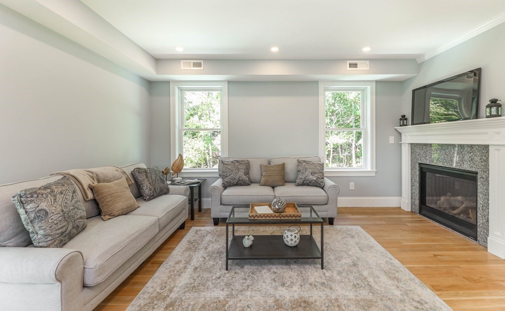 34 Colgate Road, Unit 2 Boston, MA 02131 - Photo 5 of 19 a living room with furniture and a fireplace