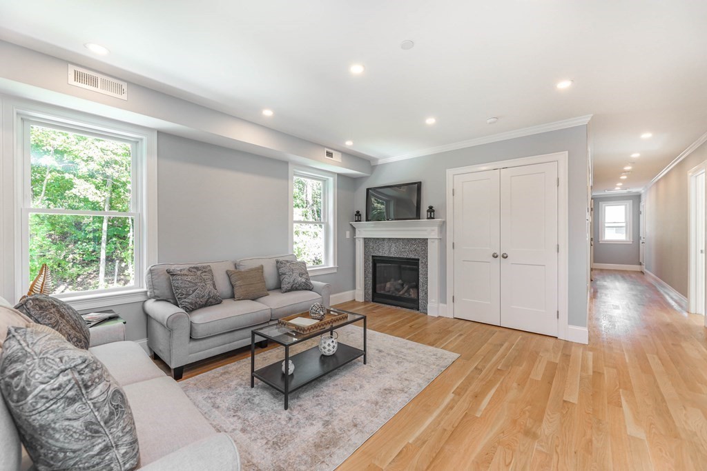 34 Colgate Road, Unit 2 Boston, MA 02131 - Photo 6 of 19 a living room with furniture and a fireplace
