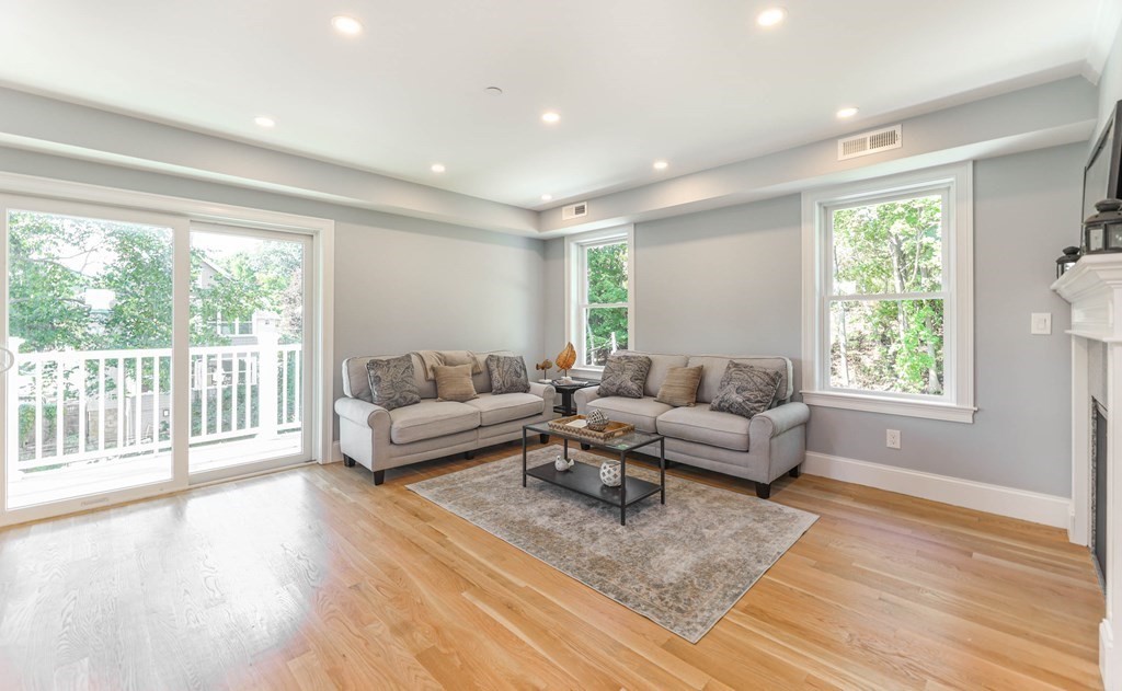 34 Colgate Road, Unit 2 Boston, MA 02131 - Photo 7 of 19 a living room with furniture and a large window