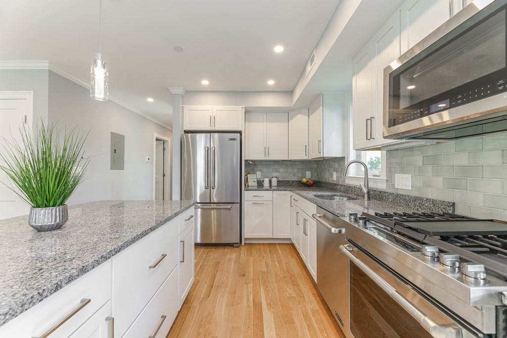 34 Colgate Road, Unit 2 Boston, MA 02131 - Photo 10 of 19 a kitchen with sink a stove and refrigerator