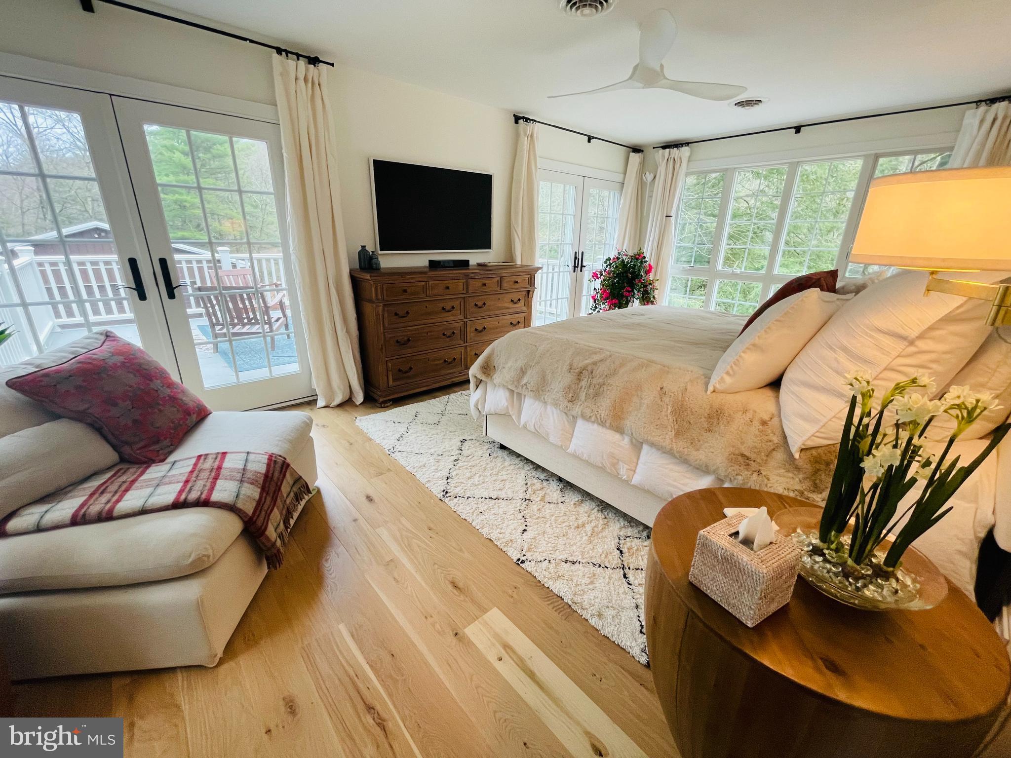 614 Graystones Jeras Road Albrightsville, PA 18210 - Photo 23 of 31 a bedroom with a bed and large windows