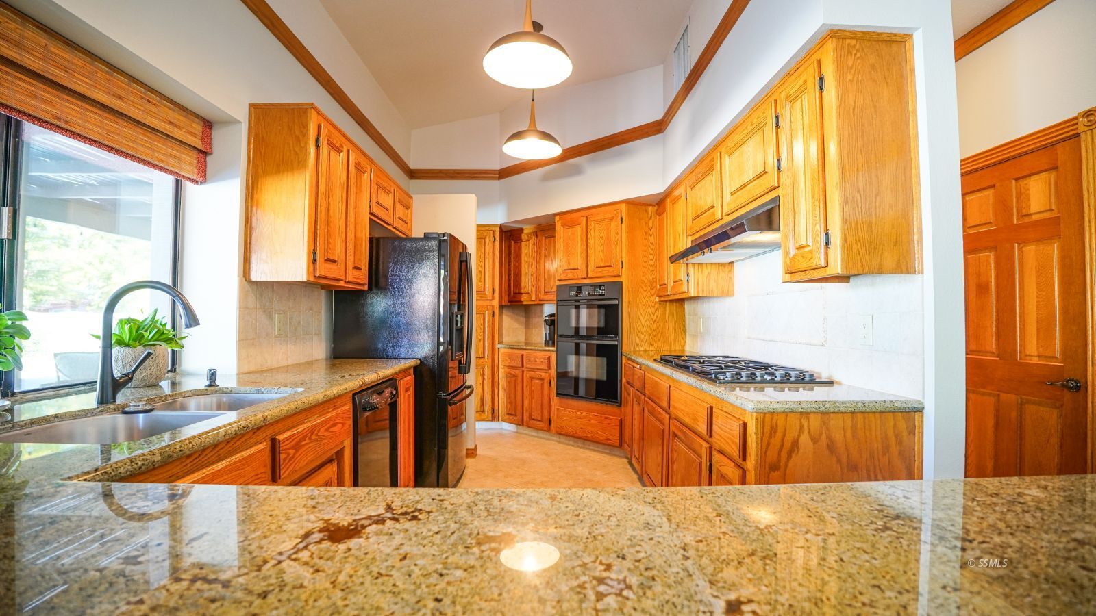 948 Hermosa Avenue Ridgecrest, CA 93555 - Photo 14 of 46 a view of staircase with open kitchen