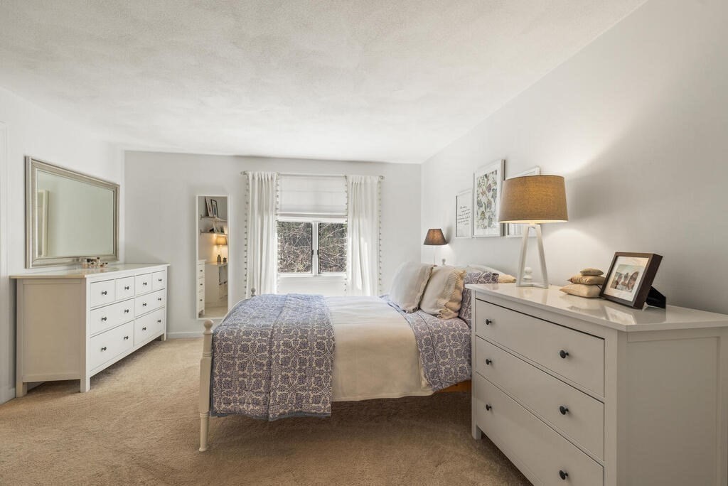 25 Fox Run Road Sudbury, MA 01776 - Photo 33 of 42 a bedroom with a bed and a flat screen tv
