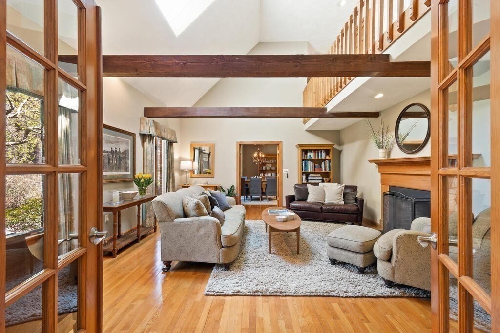 25 Fox Run Road Sudbury, MA 01776 - Photo 8 of 42 a living room with fireplace furniture and a floor to ceiling window