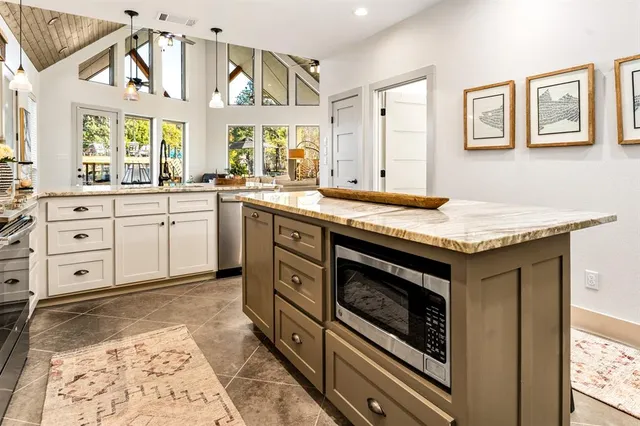 a kitchen with a stove oven and sink