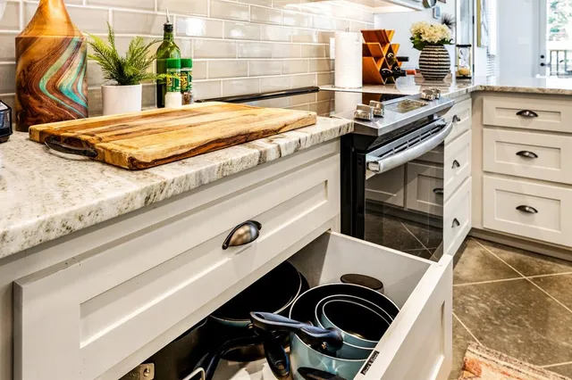 a kitchen with a stove and a sink