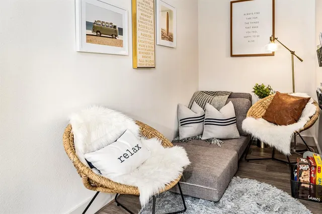 a living room with furniture and a chair
