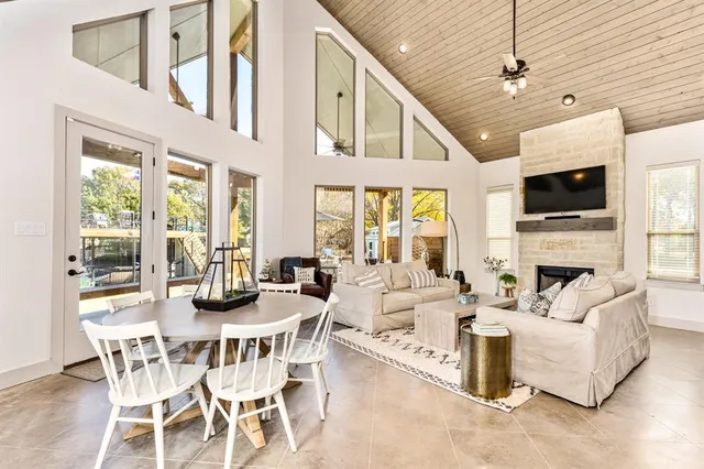 a view of a livingroom with furniture wooden floor and a chandelier