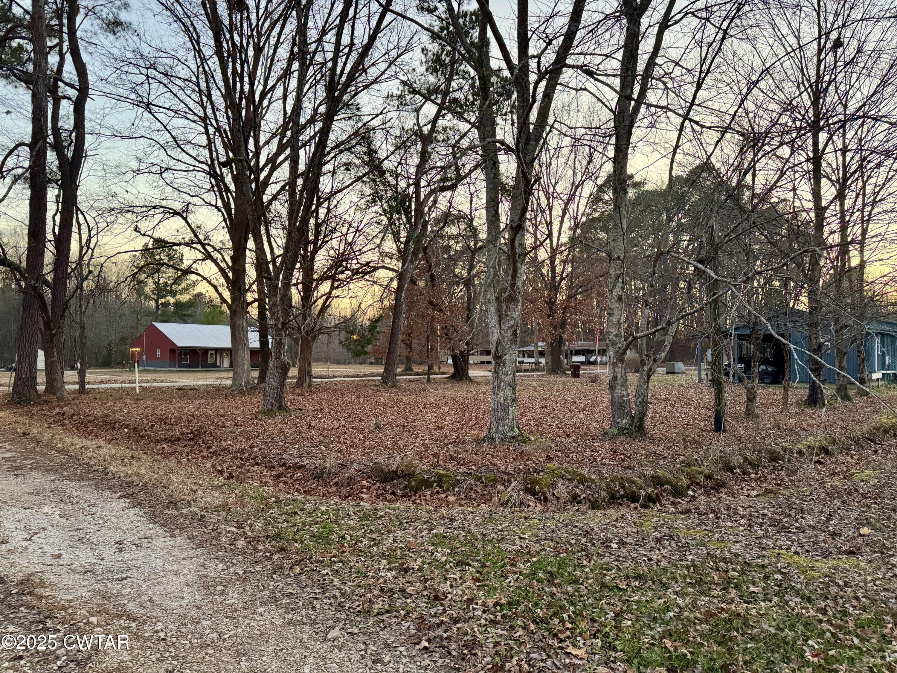 0 Sulphur Creek Road Big Sandy, TN 38221 - Photo 4 of 8 a view of house with trees in the background